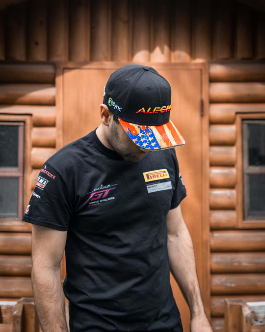 Daniel Morad wearing the official Alegra Motorsports team hat with original gold american flag printed design